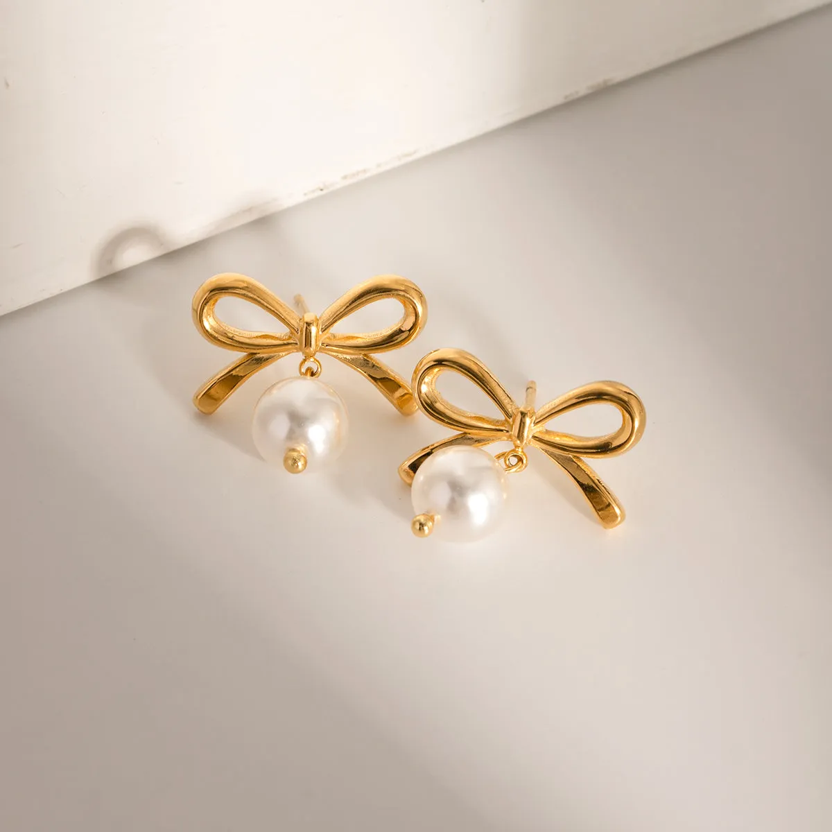 Elegant Bow Faux Pearl Stainless Steel Earrings