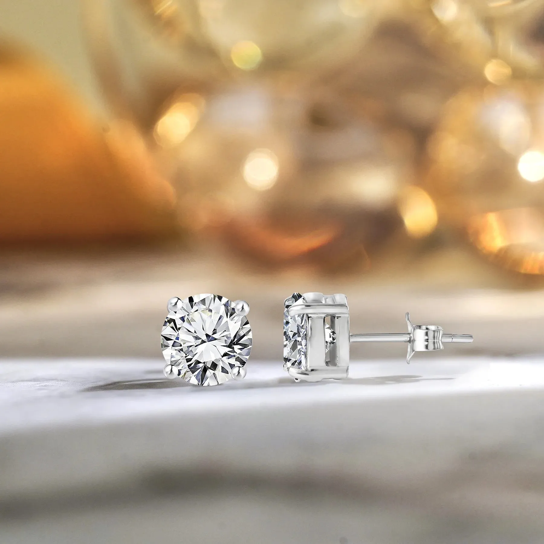 JeenMata 4 Prong 0.5 Carat Round Shaped Moissanite Solitaire Stud Earrings In 18K White Gold Plating Over Silver