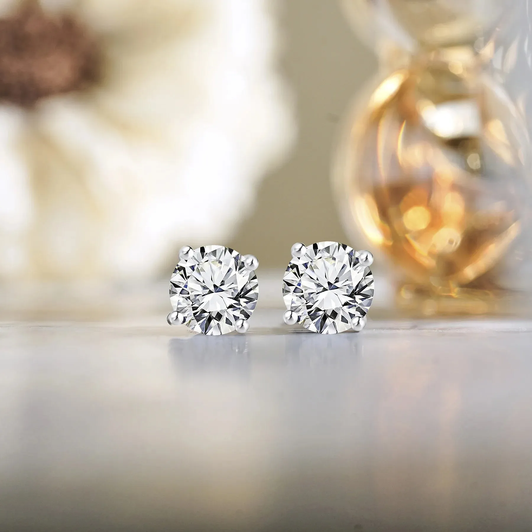 JeenMata 4 Prong 0.5 Carat Round Shaped Moissanite Solitaire Stud Earrings In 18K White Gold Plating Over Silver